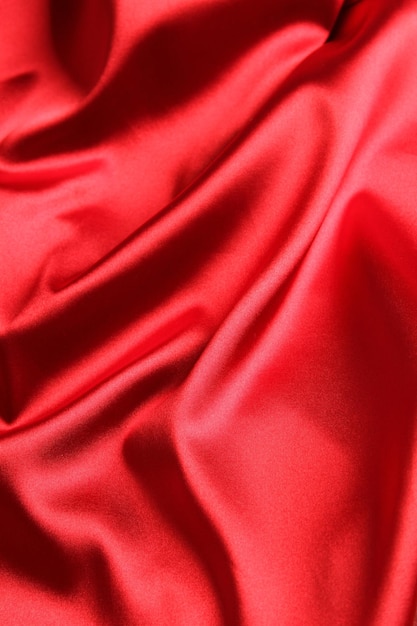 Close up of red satin fabric background