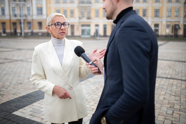 Close up on reporter taking an interview