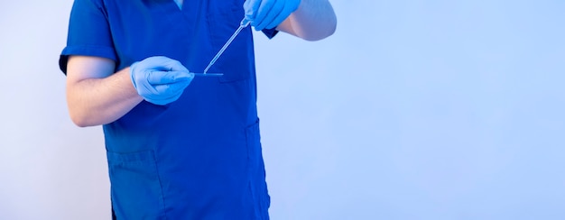 Close up researcher using disposable pipette for loads covid samples on a glass wide banner with