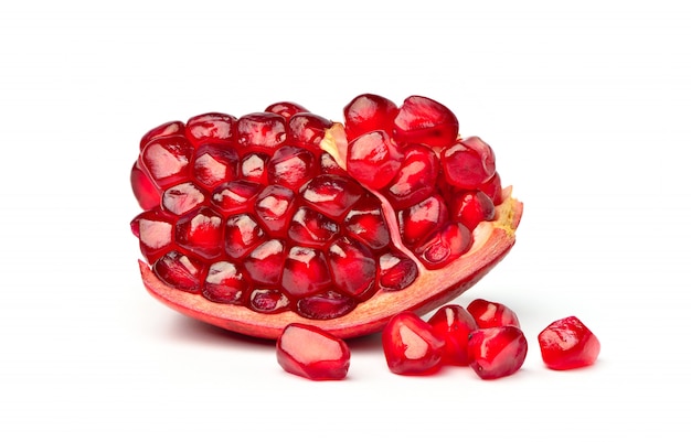 Close-up Ripe pomegranate seeds isolated on the white background.