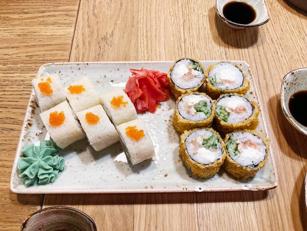 Close-up of rolls sushi set. Japanese cuisine. Tasty food. Fish and rice