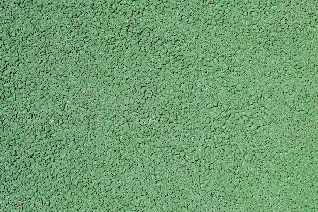 Close up of rough green asphalt road texture background