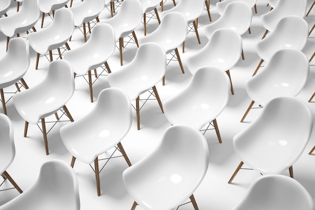 Photo close up of rows of white chairs standing in an auditorium on a white floor. concept of sameness. 3d rendering