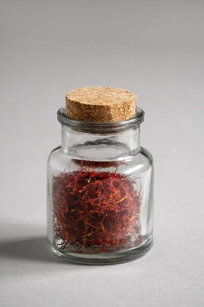 Close up on saffron in small bottle