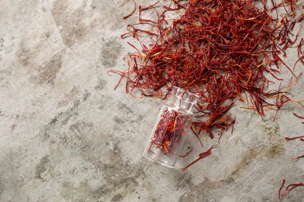 Close up on saffron in small bottle