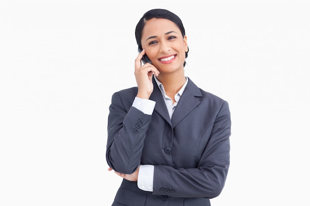 Close up of saleswoman on her mobile phone