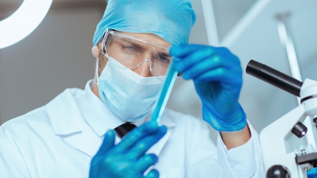 Close up. sample of the vaccine in the hands of the researcher .