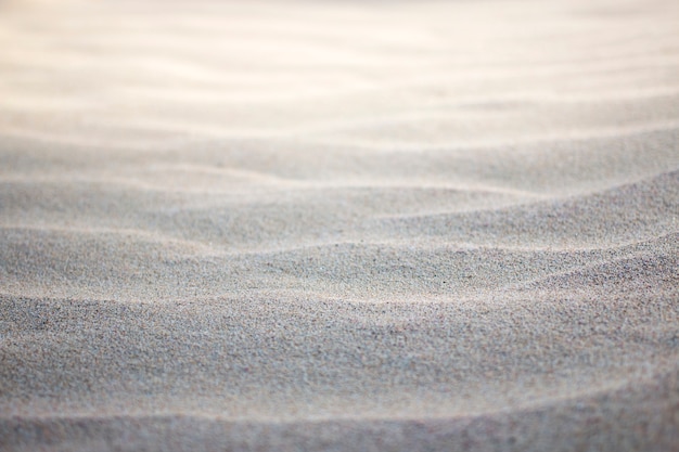 Photo close up of sand pattern of a beach.