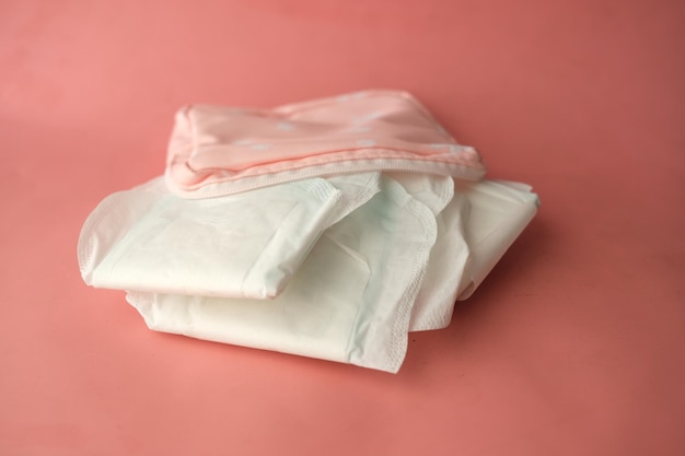 Close up of sanitary pad on a pink background