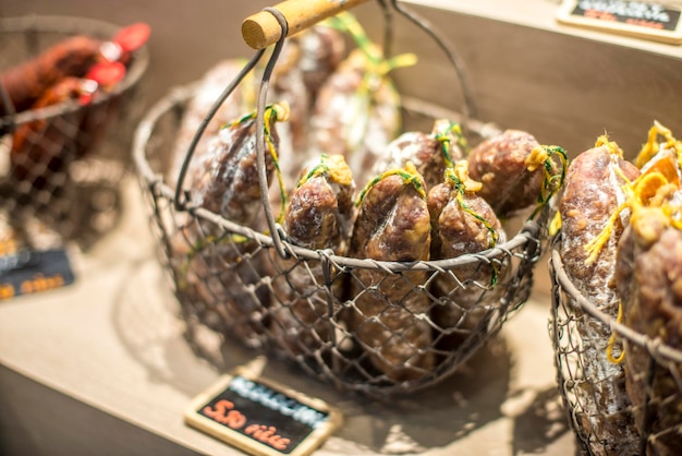 Photo close-up of sausages on display at store