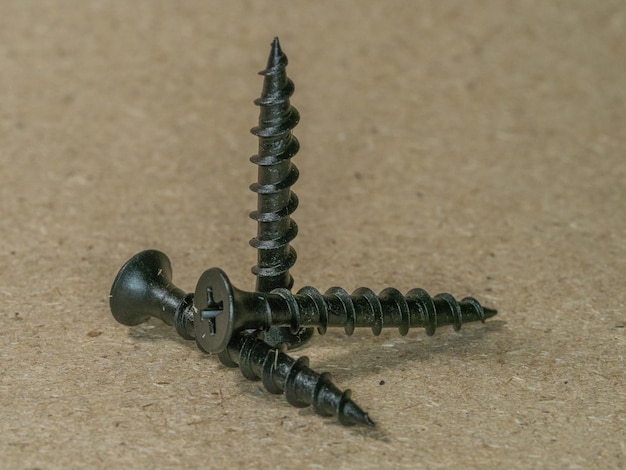 Close-up of screws on table