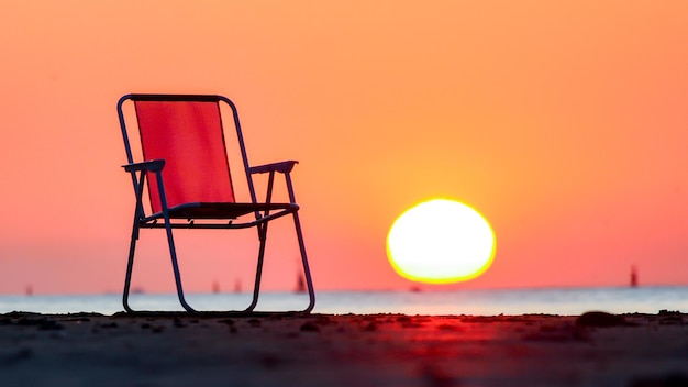 Close-up of sea against clear sky during sunset