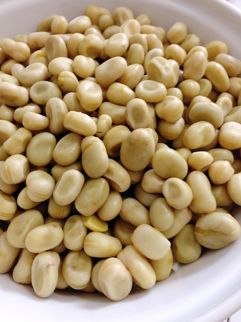 Close-up of serving boiled broad beans in bowl