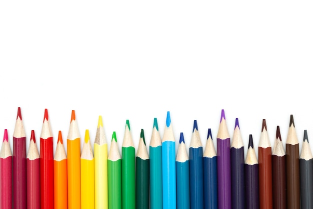 Close-up of set of colorful pencils on white background with copy space