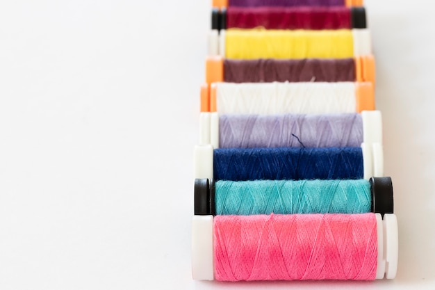 Close-up on sewing thread spools