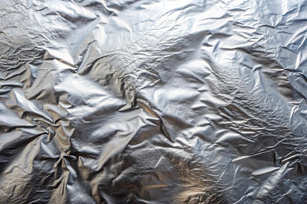 Photo a close up of a shiny piece of foil with a brown pattern