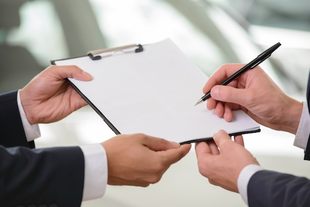 Close-up shoot of the contract signing.