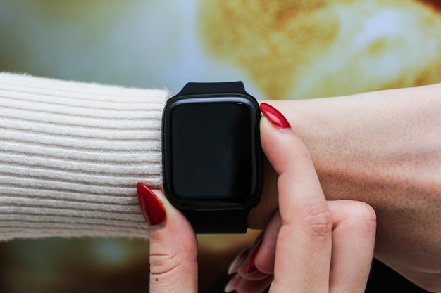 Close up shot of a businessmans hand that uses a smart watch to view incoming messages and calls to