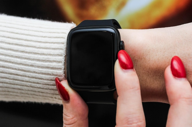 Close up shot of a businessmans hand that uses a smart watch to view incoming messages and calls to