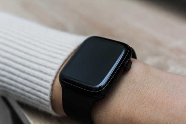 Close up shot of a businessmans hand that uses a smart watch to view incoming messages and calls to