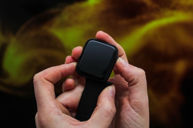 Close up shot of a businessmans hand that uses a smart watch to view incoming messages and calls to