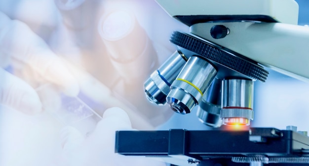  Close-up shot of microscope equipment with metal lens at microbiologal laboratory