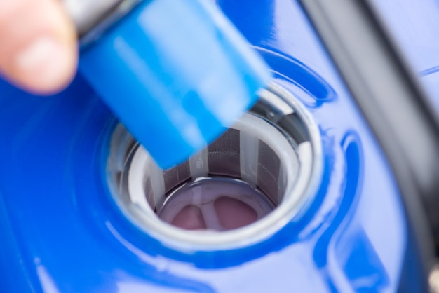 Close up shot of open fuel tank of generator