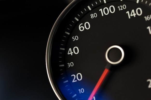 Close up shot of a speedometer in a car