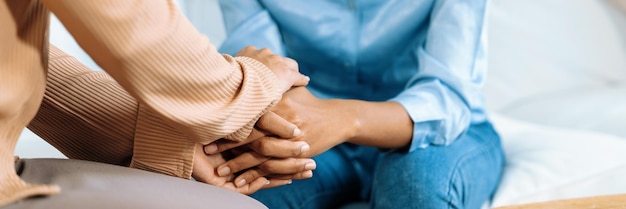 Photo close up shot of supportive and comforting hands for cheering up depressed patient person or stressed mind with crucial empathy