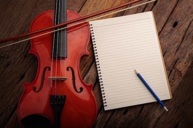 Close-up shot violin orchestra instrumental and notebook