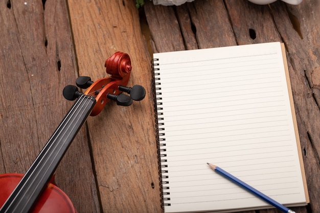 Close-up shot violin orchestra instrumental and notebook