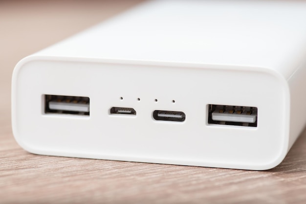 Close up shot of white modern powerbank on the table