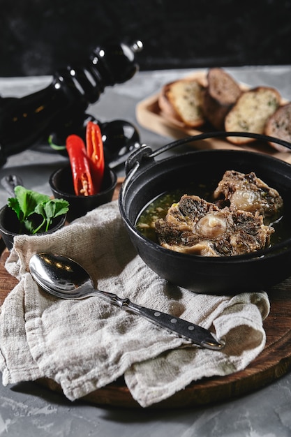 Close up of shurpa soup in a cast iron pot