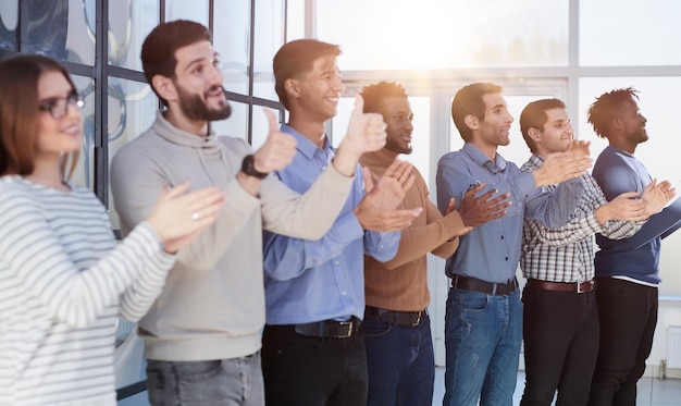 Photo close up side profile different participants business people stand and express appreciation by clapping their hands