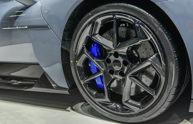 A close up of a silver lamborghini murcielago wheel