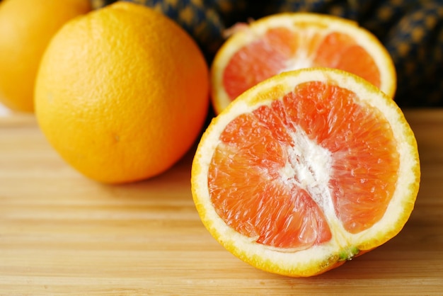 Close up of slice of orange fruit on color background