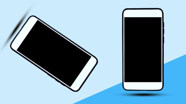 Close-up of smart phones levitating against blue background