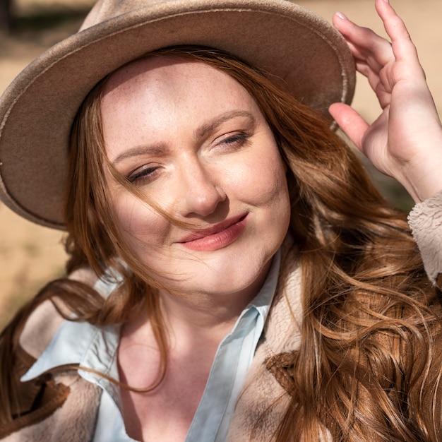 Close up smiley woman with hat