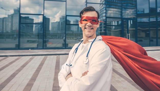 Close up. smiling doctor superhero looking forward. photo with a copy of the space.