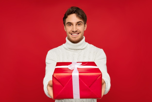 Close up on smiling man in knitted sweater isolated