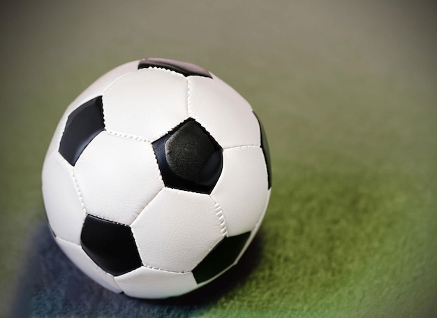 Close up of a soccer ball in the center of the stadium