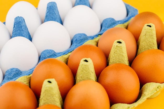 close up some fresh eggs in blue box carton. shop concept.