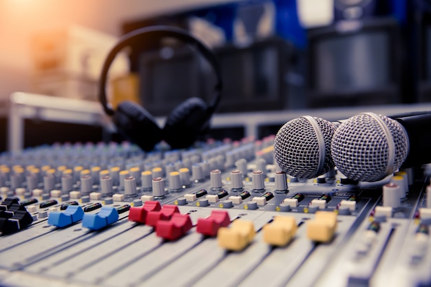 Close-up sound mixer and microphones related at meeting room.