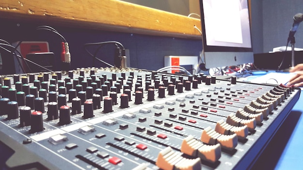 Close-up of sound recording equipment at studio