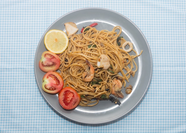 close up of spaghetti with seafood on plate