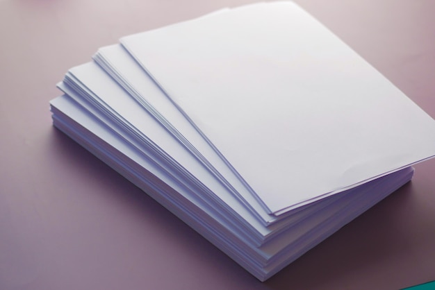 Close up of stack of empty paper on table