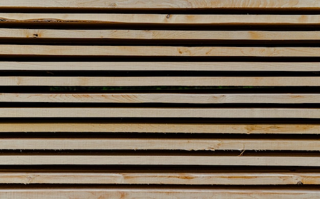 Photo close up of stacked wooden boards in a line