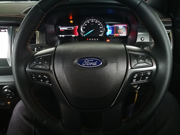 Close-up of steering wheel in car