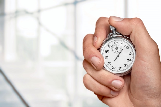 Photo close-up stopwatch in human hand, timer