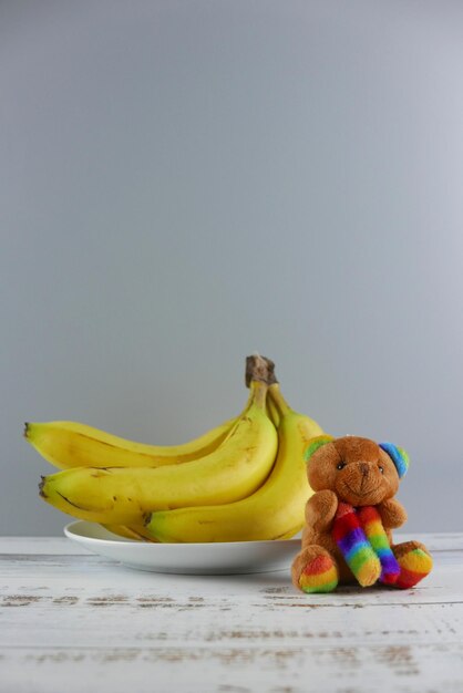 Photo close-up of stuffed toy on table against white background